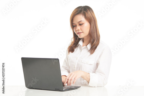 Office Lady in White Shirt using laptop