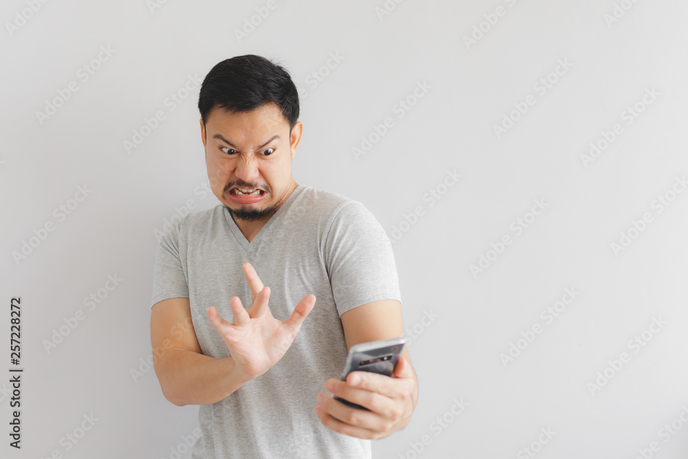 Man feels hate and disgusted with what show on the smartphone. Man feels hate and disgusted with what show on the smartphone.