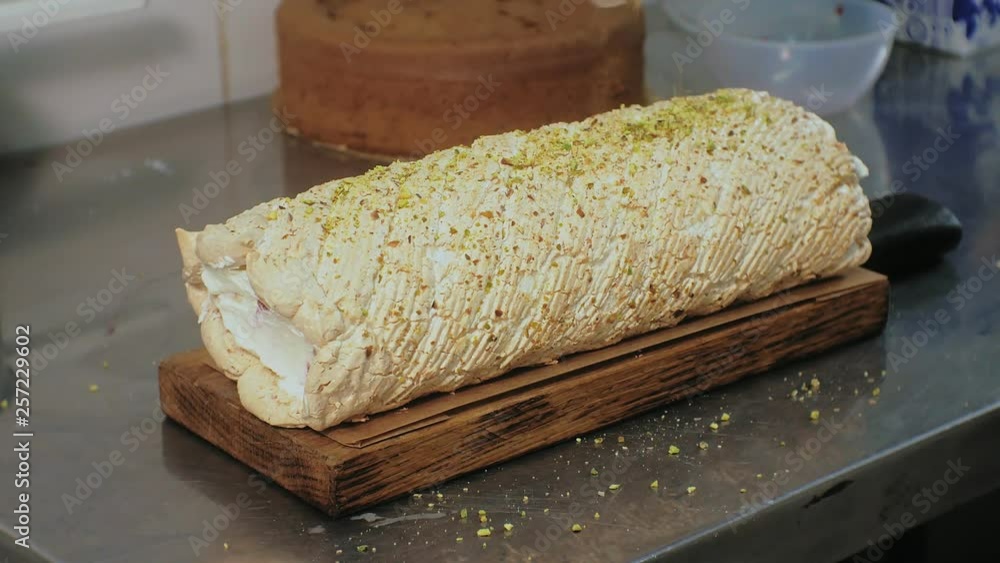 The concept of cooking. Professional pastry chef makes a delicious cake, closeup The concept of cooking. Professional pastry chef makes a delicious cake, closeup