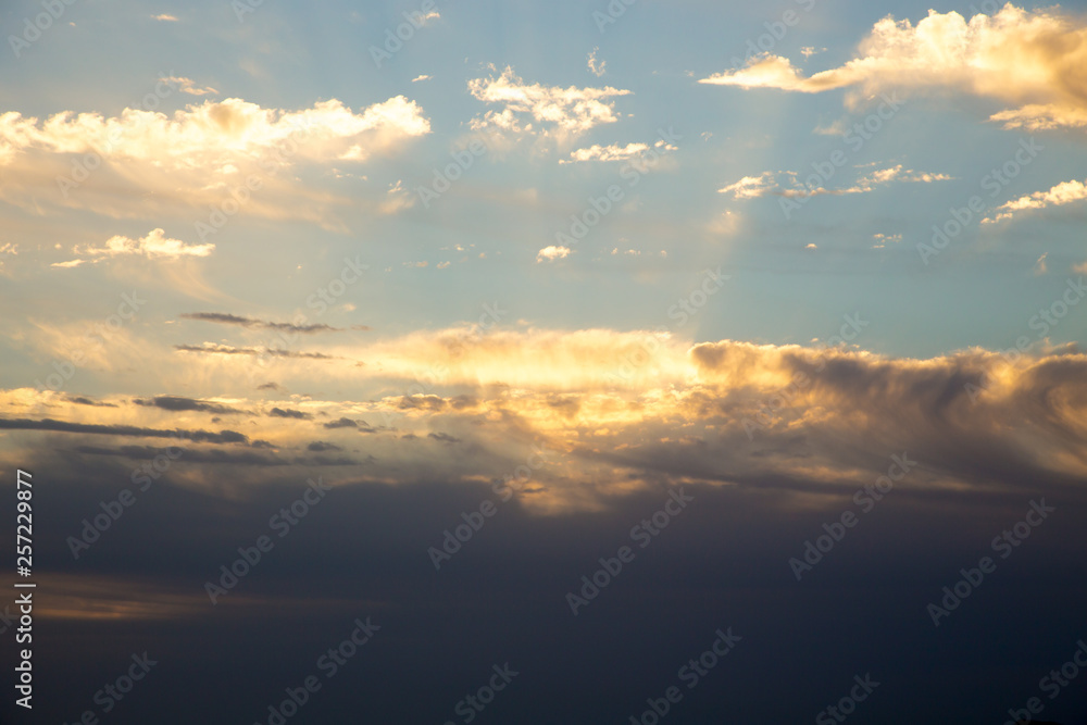Obraz premium Bright blue sky with gentle cumulus clouds. Pink vanilla heaven. Natural summer and spring background.