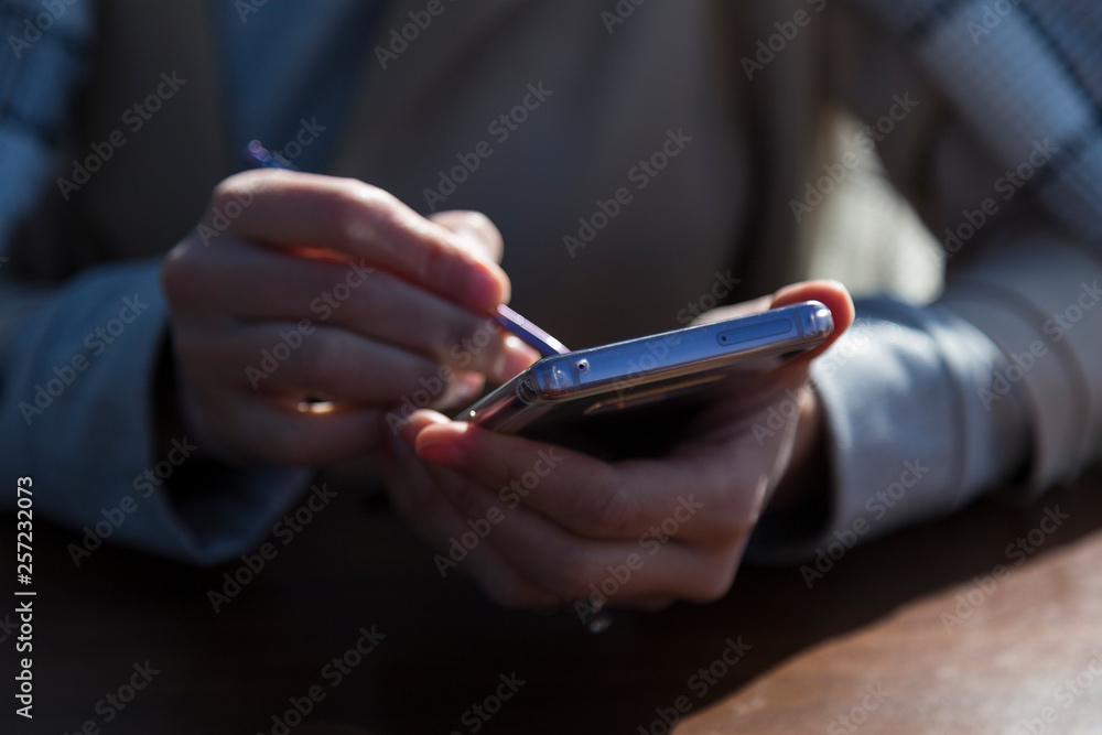 the man or woman hold the smart phone in the hand. the man or woman hold the smart phone in the hand.