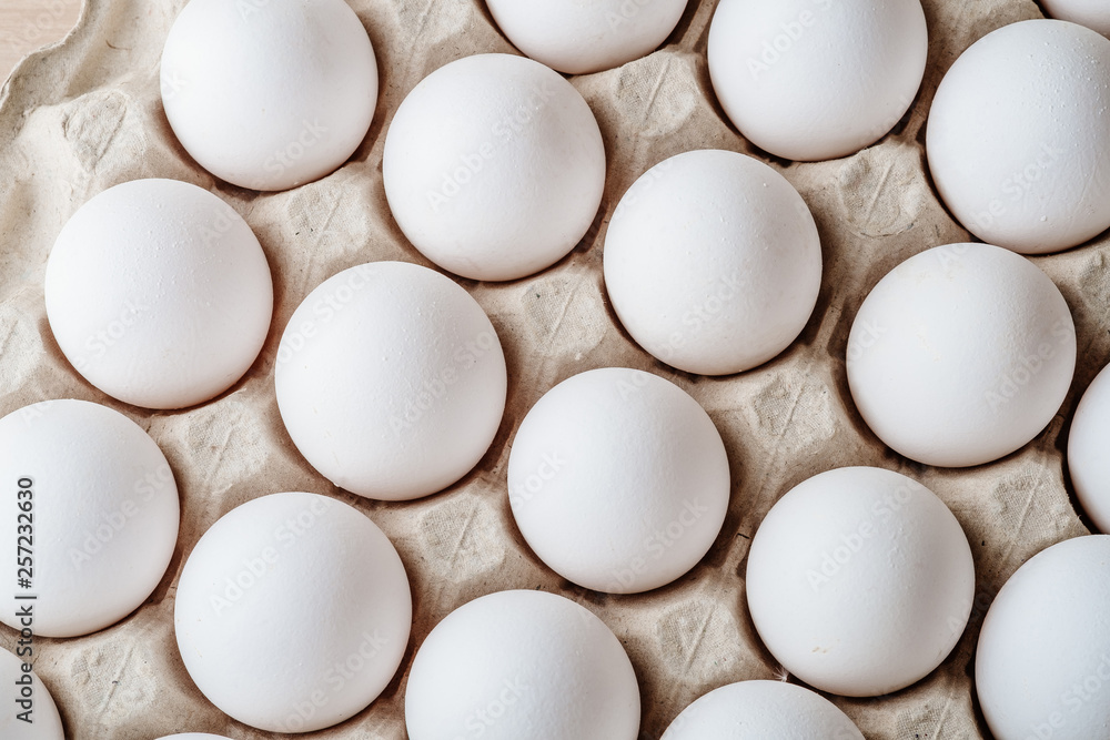 Many white chicken eggs food in tray box Many white chicken eggs food in tray box