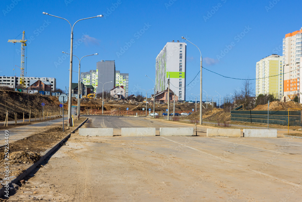 Closed road with concrete slabs in empty Minsk. road slab. Blocked by Closed road with concrete slabs in empty Minsk. road slab. Blocked by
