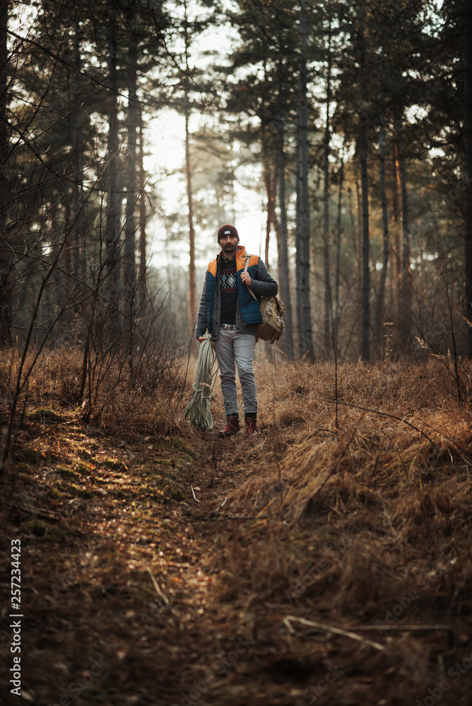 Obraz premium 30-40 years old man hiker in the forest