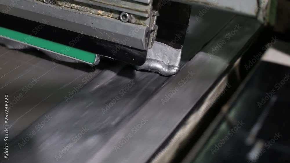 Close-up Industrial Printing Press Puts Silver Paint On The Canvas Close-up Industrial Printing Press Puts Silver Paint On The Canvas