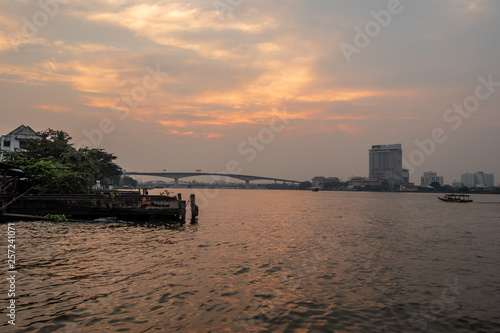Beautiful and charming river views with the cloudy sunset sky background
