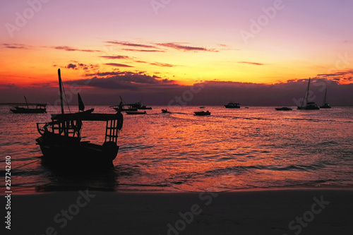 Ships against the background of a beautiful sunset on the ocean in Africa. Zanzibar Island  Tanzania