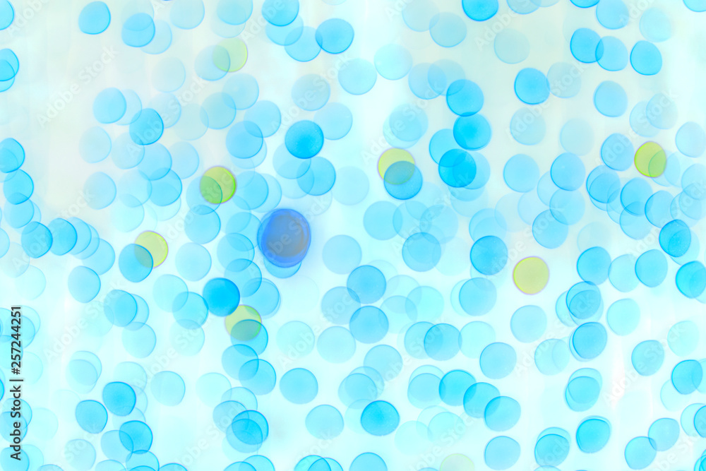 Blurred blue bokeh on light background. Illustration of the structure of the objects under high magnification. Blurred blue bokeh on light background. Illustration of the structure of the objects under high magnification.