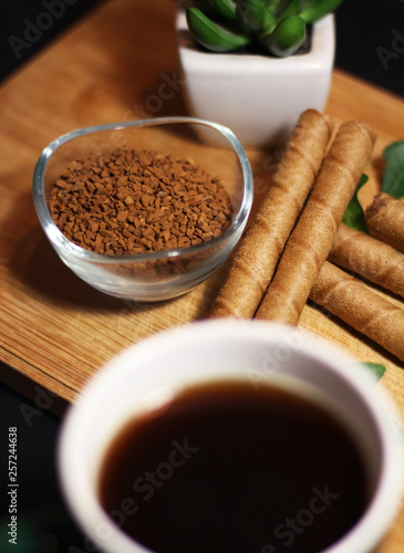 Breakfast time with coffee cup and chocolate sticks