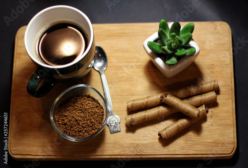 Breakfast time with coffee cup and chocolate sticks