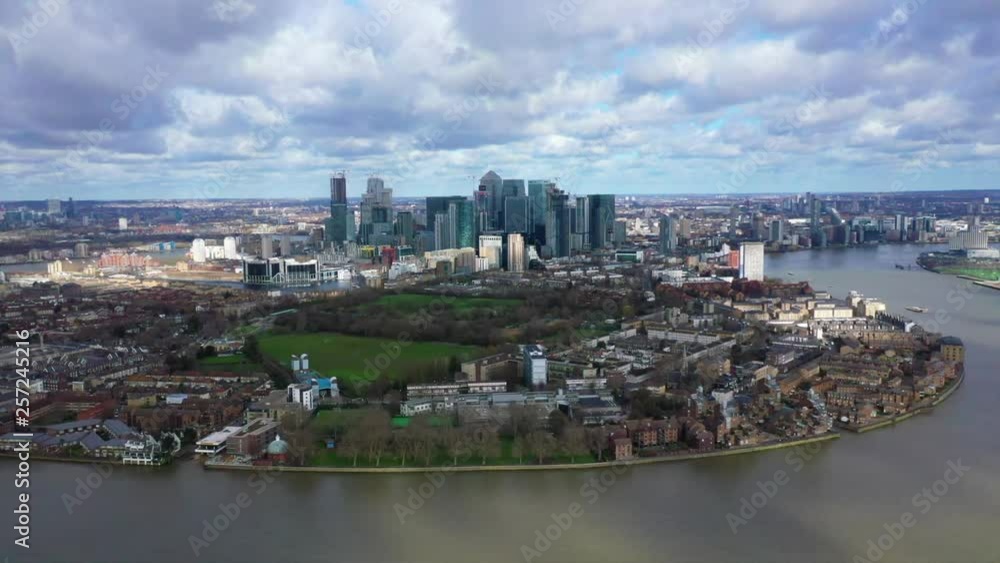 Aerial bird's eye panoramic video taken by drone of iconic Canary Wharf skyscraper complex and business district with beautiful clouds, Isle of Dogs, London, United Kingdom Aerial bird's eye panoramic video taken by drone of iconic Canary Wharf skyscraper complex and business district with beautiful clouds, Isle of Dogs, London, United Kingdom