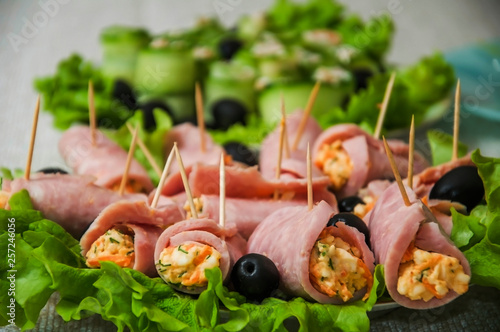 ham rolls on skewers with lettuce leaves