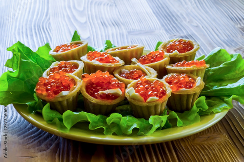 tartlets with red caviar and lettuce