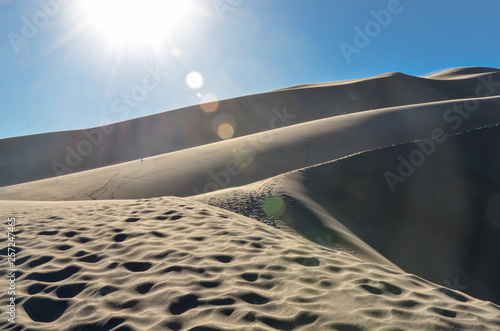 climbing the slopes of High Dune in Great Sand Dunes National Park and Preserve (Saguache county, Colorado, USA) photo