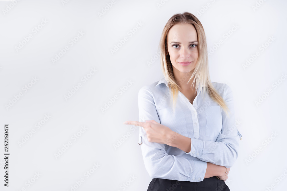 Beautiful girl is standing on a white background and shows on you Beautiful girl is standing on a white background and shows on you