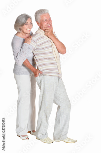 Portrait of beautiful senior couple posing on white background