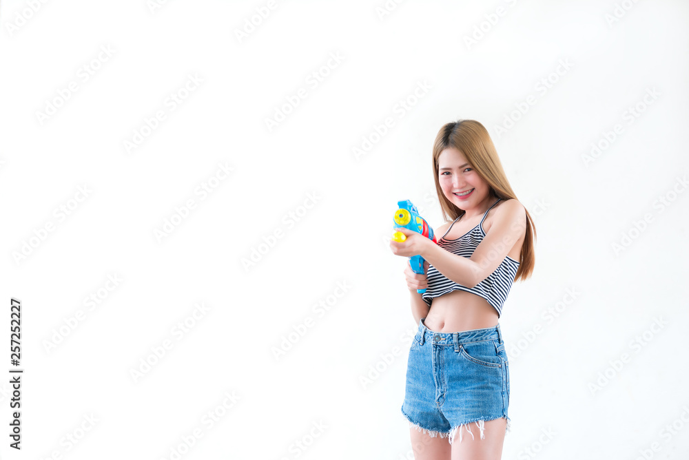 Asian sexy woman with gun water in hand on white background,Festival songkran day at thailand,The best of festival of thai,Land of smile Asian sexy woman with gun water in hand on white background,Festival songkran day at thailand,The best of festival of thai,Land of smile