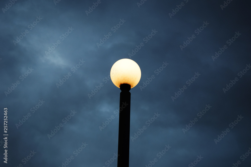 Street lamp against a dark blue sky. Street lamp against a dark blue sky.