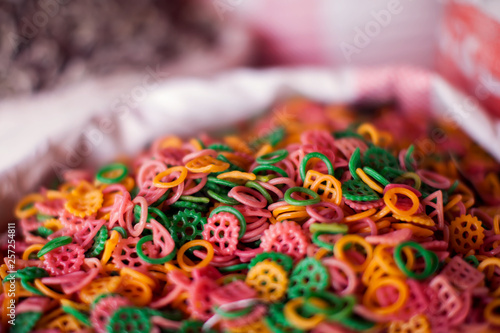 Colored pasta in bag in the market, top view