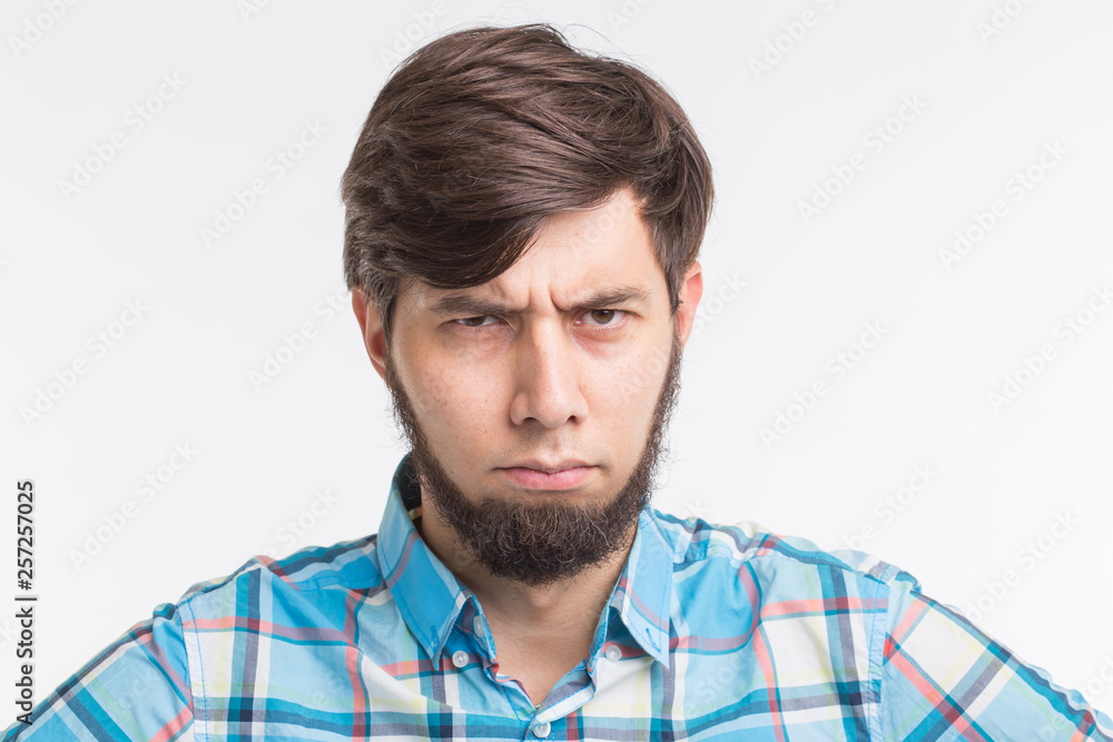 People, gesture and emotions concept - Sad or angry bearded man on white background People, gesture and emotions concept - Sad or angry bearded man on white background