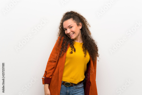 Teenager girl with coat smiling © luismolinero