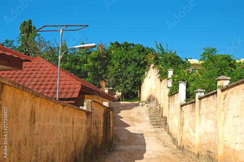 Cozy lane on the island of Zanzibar on a sunny summer day