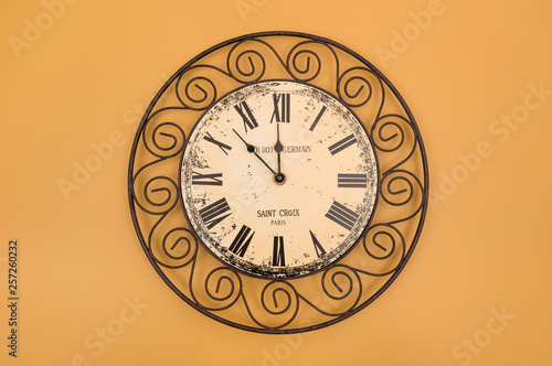 Vintage style round clock on the wall