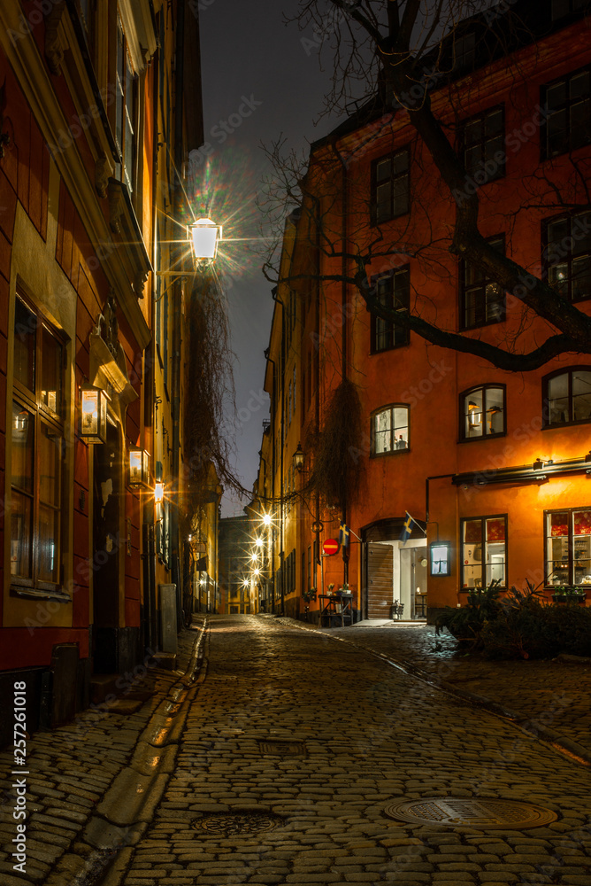 Old cobbled narrow street in Stockholm at night