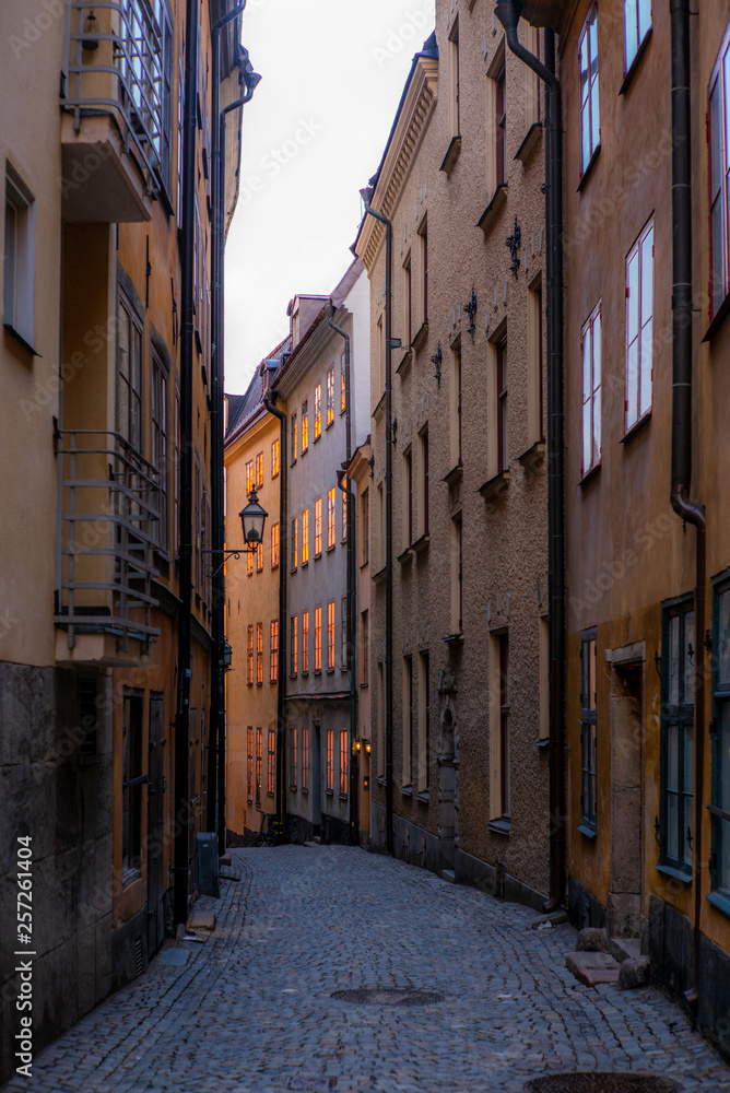 Old cobbled narrow street with colorful houses in Stockholm in the morning - 10