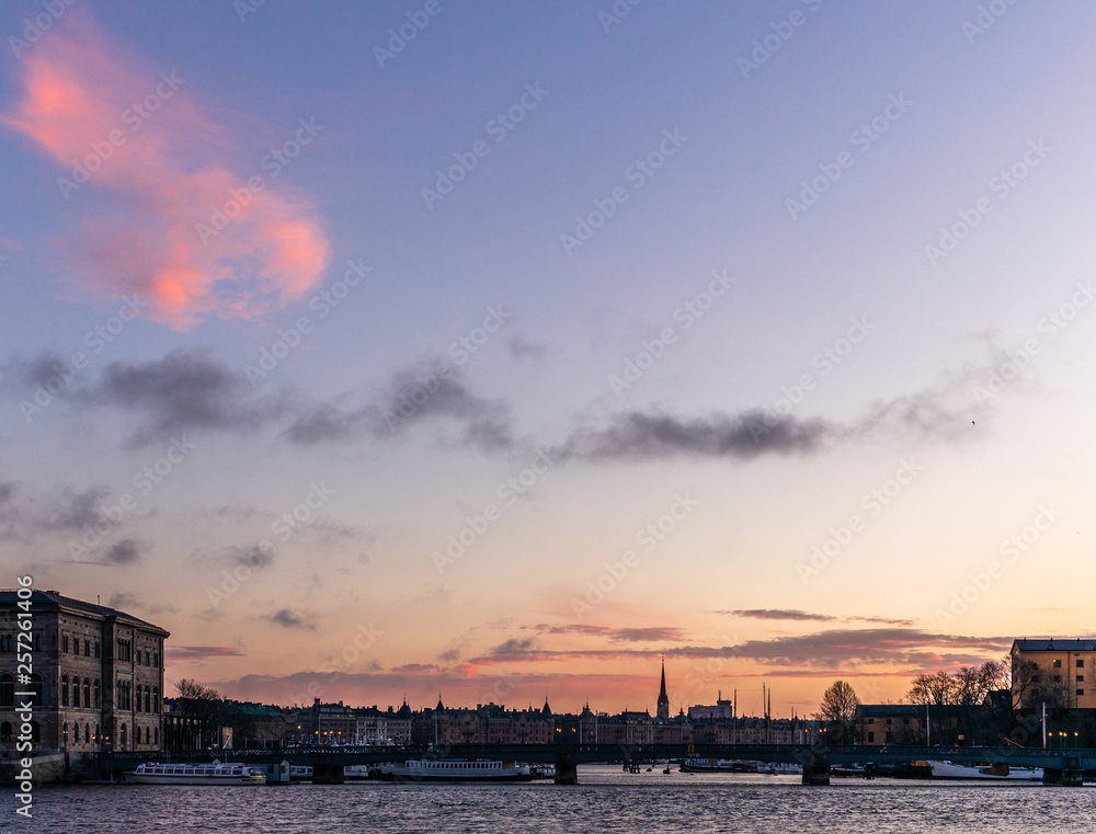Ships, towers and bridges in the harbor of  Stockholm during a colorful sunrise in winter   - 2