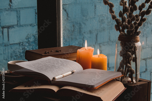  books coffee candles on the table