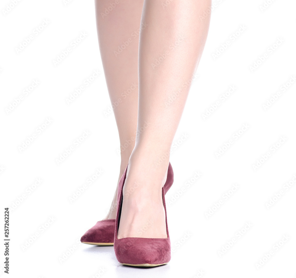 Female legs with red high heels shoes fashion on background isolation Female legs with red high heels shoes fashion on background isolation