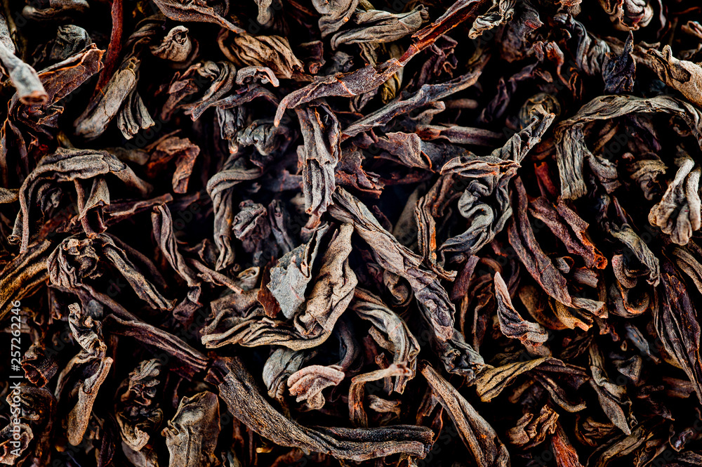 Aromatic natural black loose leaf tea shot close up Aromatic natural black loose leaf tea shot close up