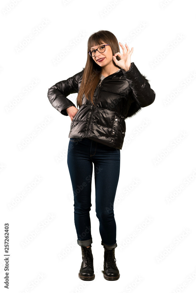 Full-length shot of Woman with glasses showing ok sign with fingers Full-length shot of Woman with glasses showing ok sign with fingers