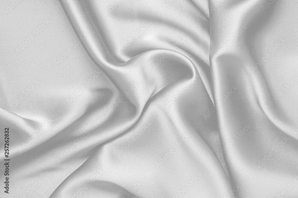 Fototapeta premium Rippled white silk fabric satin cloth waves background