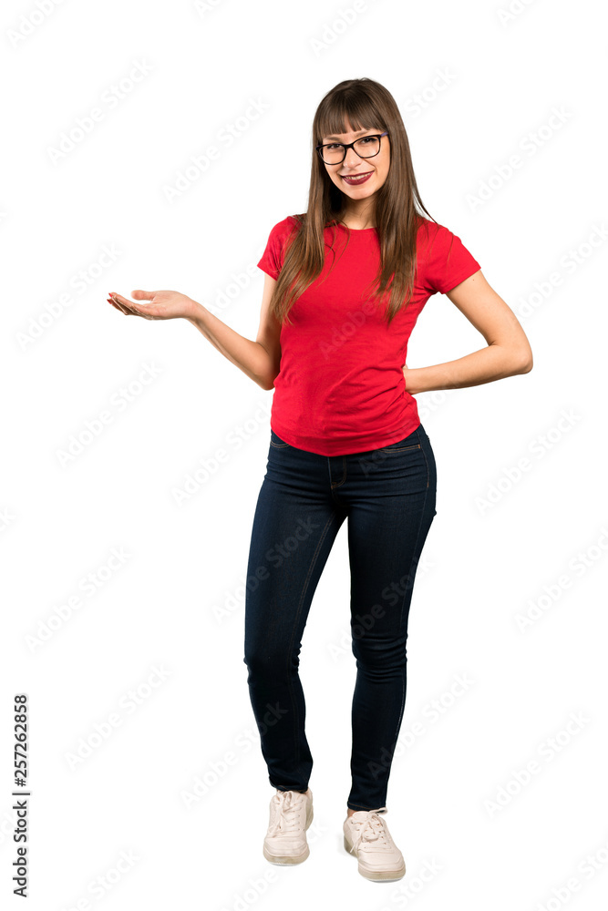 Full-length shot of Woman with glasses holding copyspace imaginary on the palm to insert an ad Full-length shot of Woman with glasses holding copyspace imaginary on the palm to insert an ad