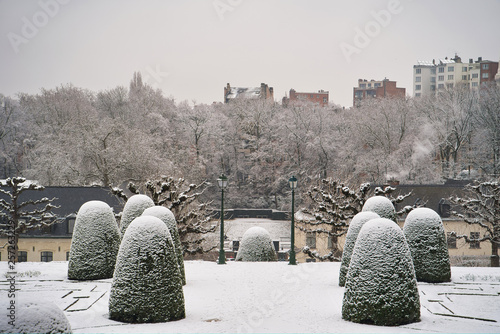 Obraz na płótnie BRUSSELS, BELGIUM - JANUARY 30, 2019: Garden of Cumbre Abbey (Jardins de l'Abbaye de la Cambre). Park in the style of French classicism with green alleys and terraces, fallen snow w salonie