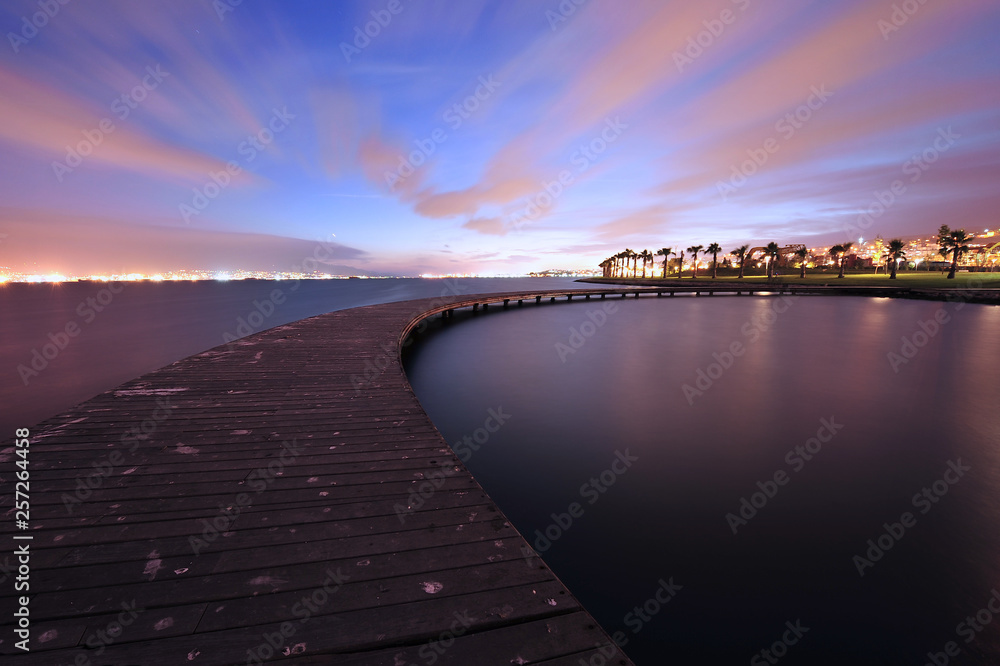  Curved Pier at dusk and cloud movement