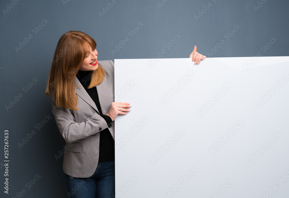 Redhead business woman holding a placard for insert a concept Redhead business woman holding a placard for insert a concept