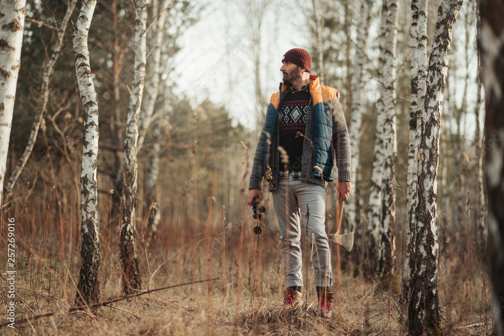 Fototapeta premium Man with binoculars in the forest