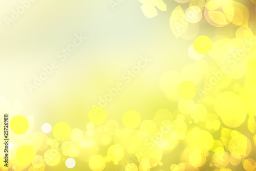 Sunny abstract bright yellow green bokeh autumn background texture with leaves. Space for your design. Beautiful yellow illustration.