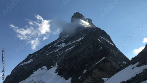 Matterhorn mountain covered by clouds time-lapse  photo