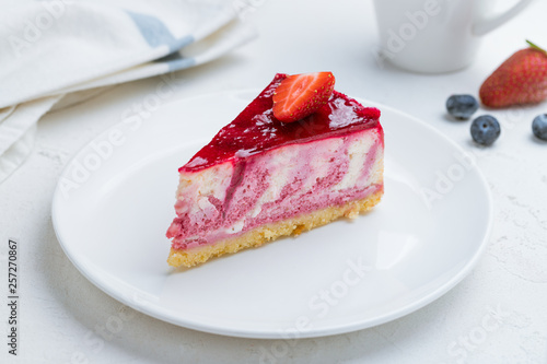 strawberry cheesecake on a white plate