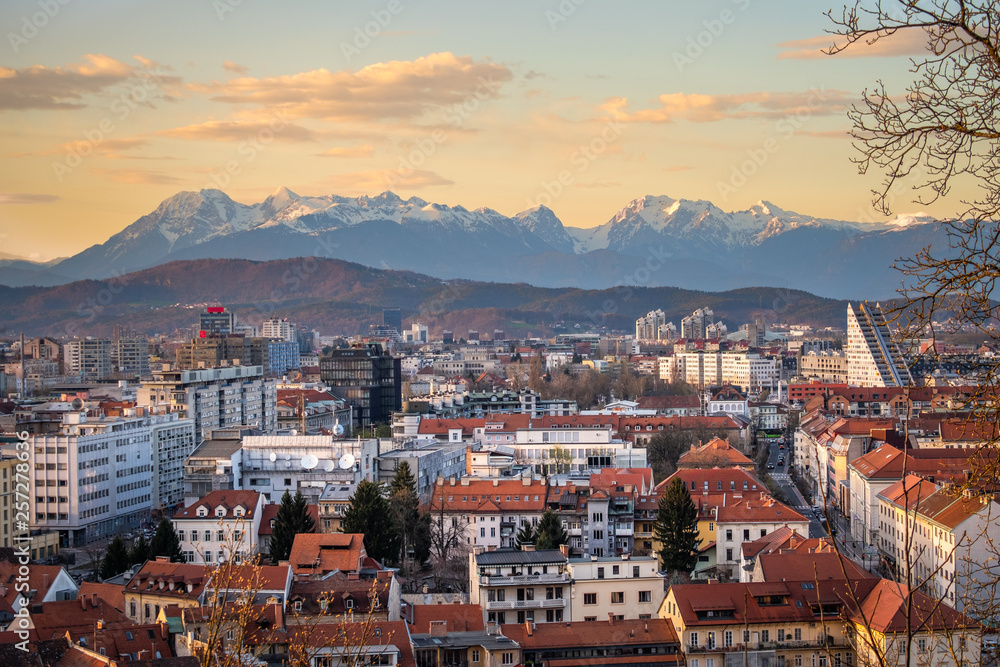 View over Ljubljana with sunset to mountain range Kamnik–Savinja Alps