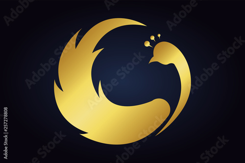 silhouette of a wild bird. Golden peacock vector logo. Head of the peafowl with raised wings.