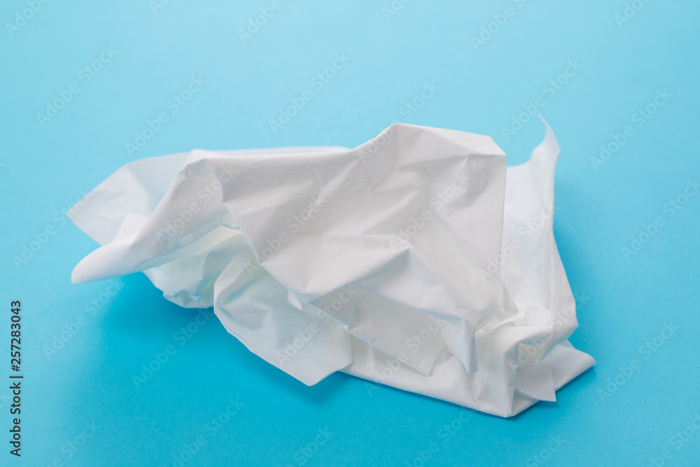 white tissue paper on blue background