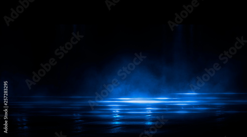 Dark empty scene, blue neon searchlight light, wet asphalt, smoke, night view, rays.