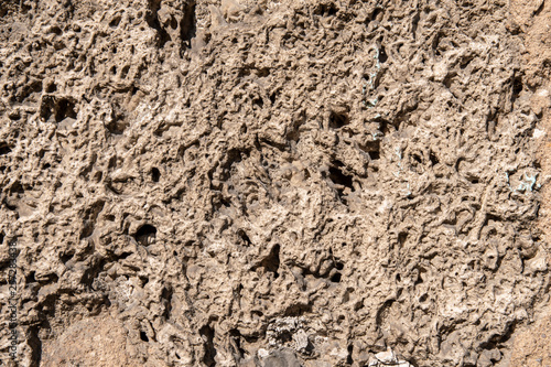 Coarse concrete plaster on a house wall as a background