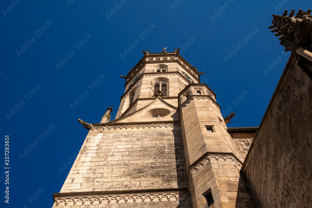Church with church tower in front of blue sky in Bad Urach Church with church tower in front of blue sky in Bad Urach