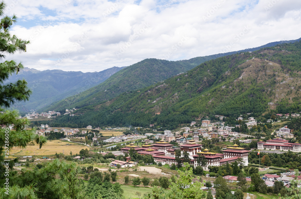 Tashichho Dzong, also known as Dzong of Thimphu, in Thimphu the capital of Bhutan. Dzongs are fortress like buildings which house a monastery and governmental office rooms. View of the Thimphu Valley.